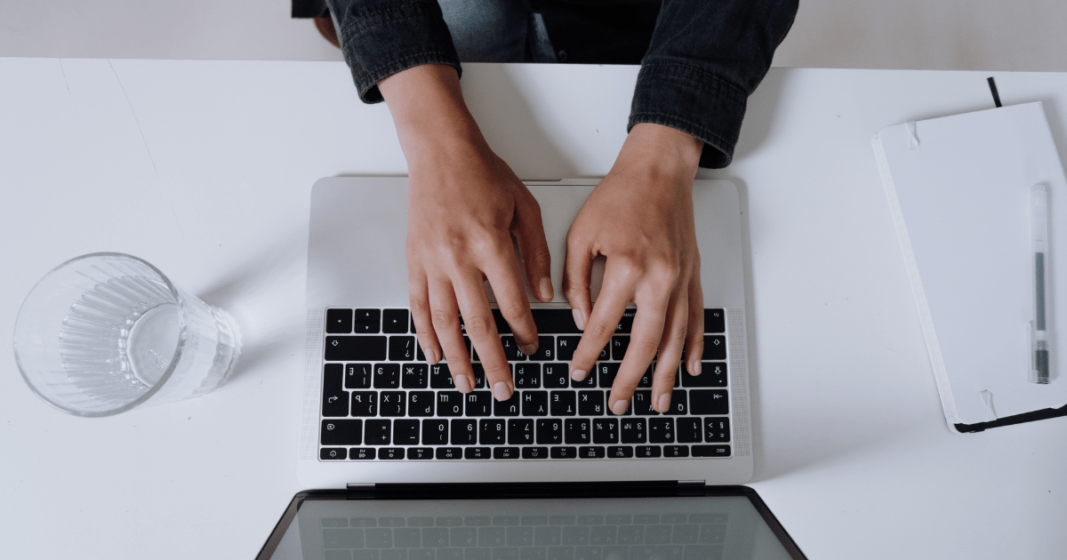 Image of woman typing on keyboard searching for small business blogging resources