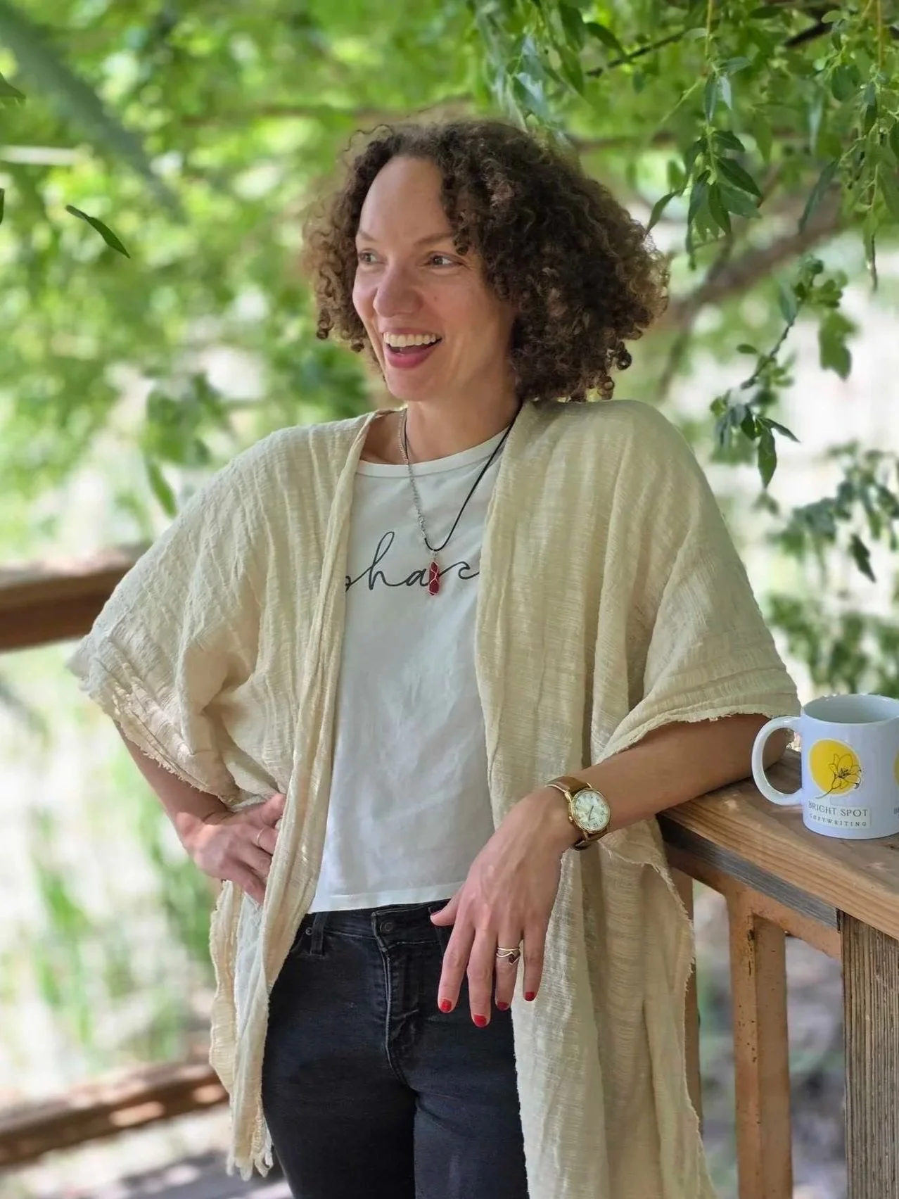 Stéphanie McGuirt standing outdoors near a wooden fence