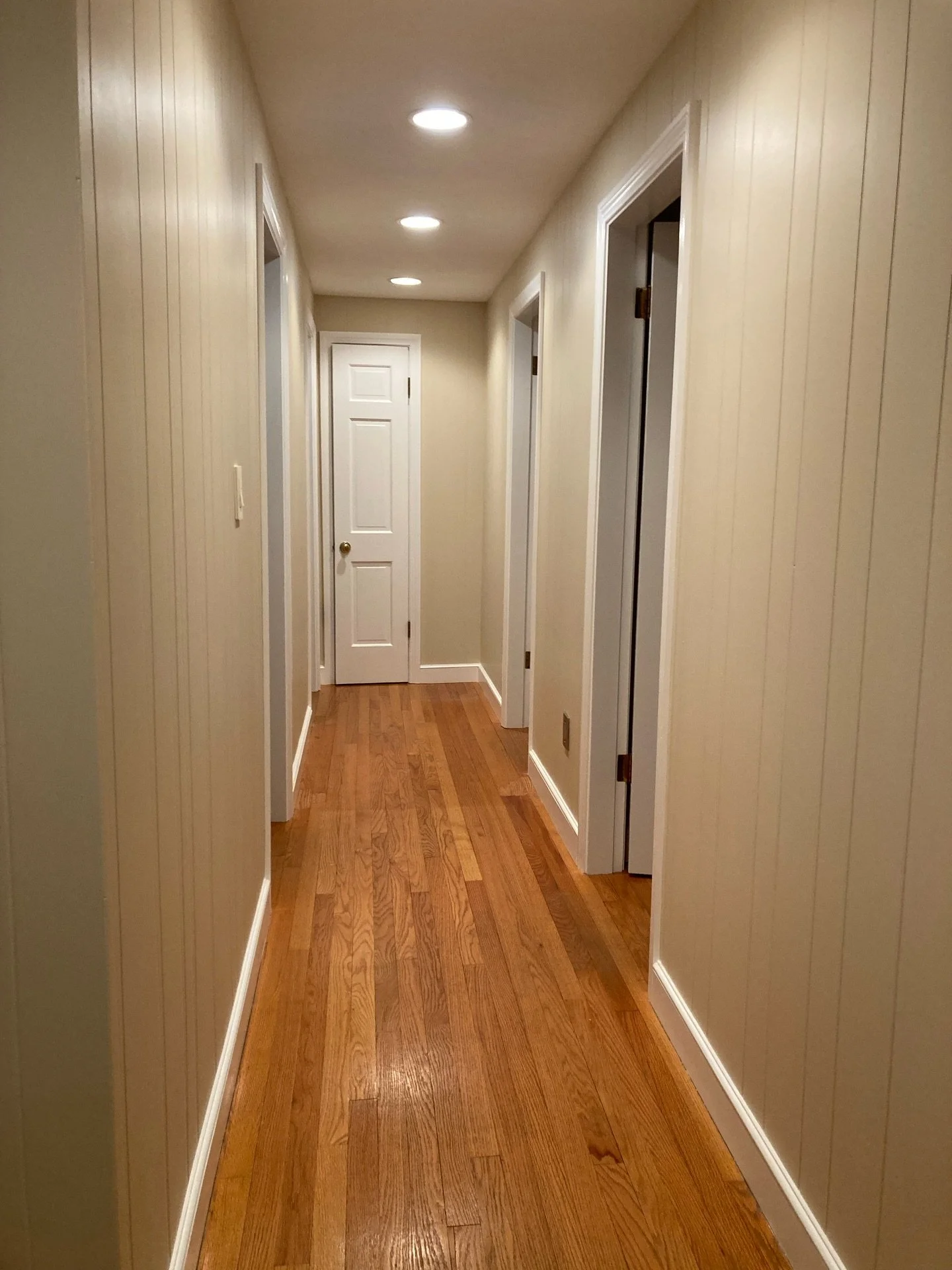 Updated old wood panel walls and trim for this Sebago Lake house.