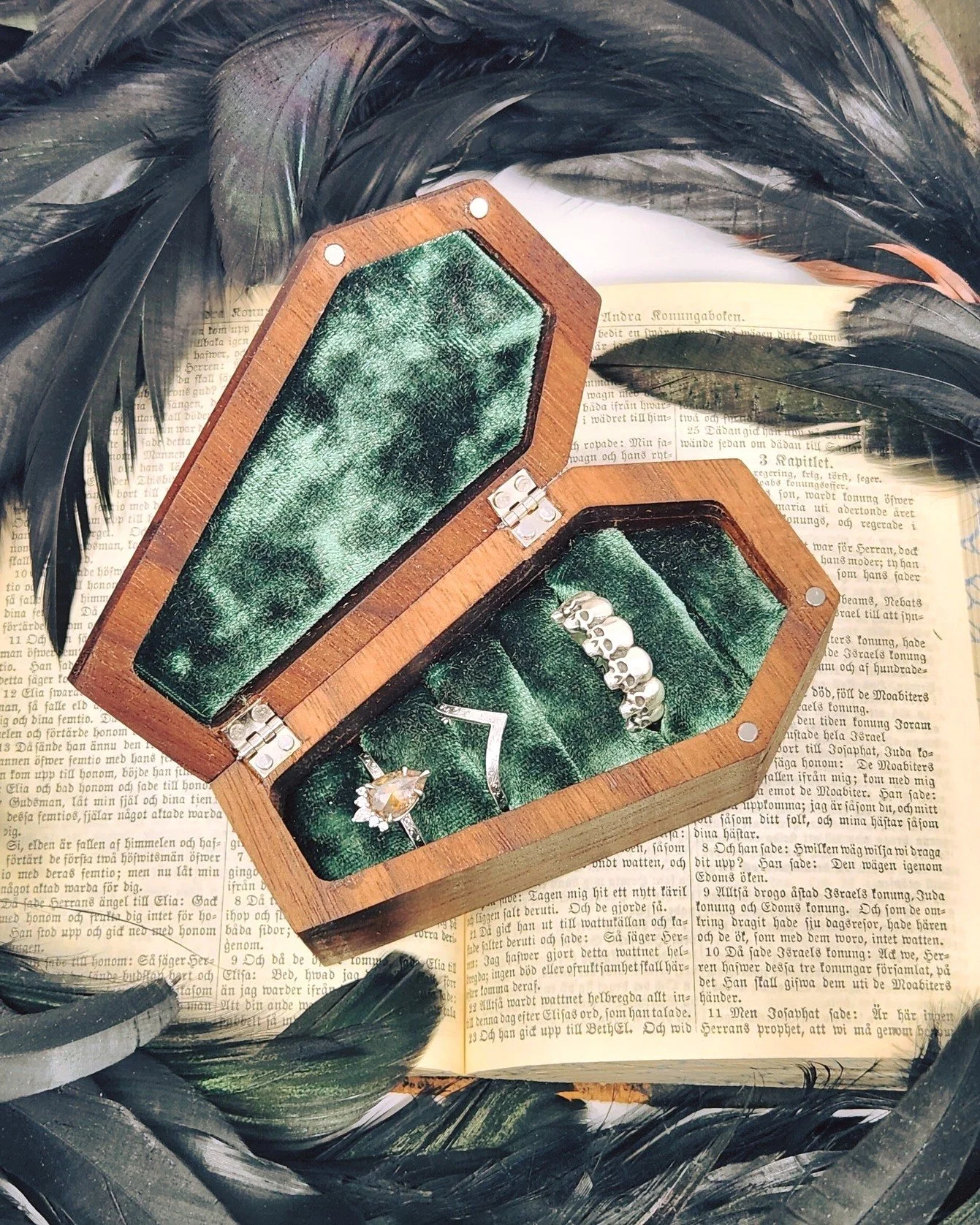 NOW AVAILABLE - 
A truly unique piece of artistry designed for those who appreciate the gothic charm . Made from premium Walnut, the coffin box's sleek finish showcases the natural grain, bringing out the richness and warmth of the material. This com