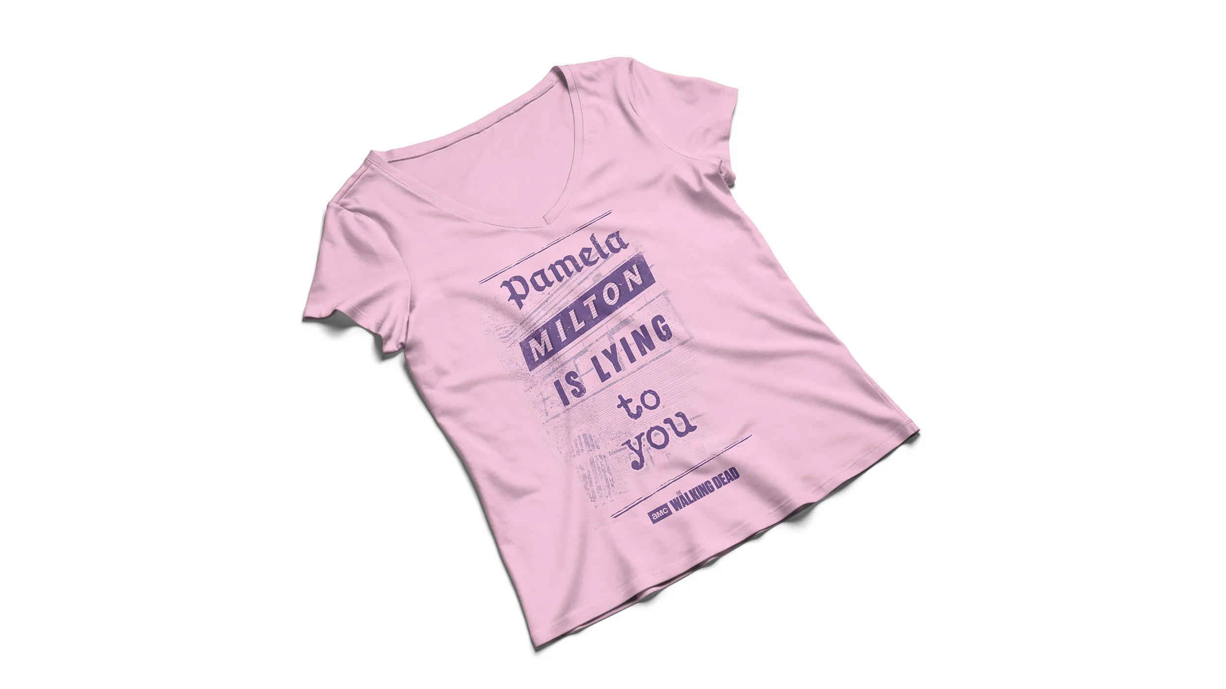 Pink T-shirt with “Pamela Milton is lying to you” graphic from AMC’s The Walking Dead.