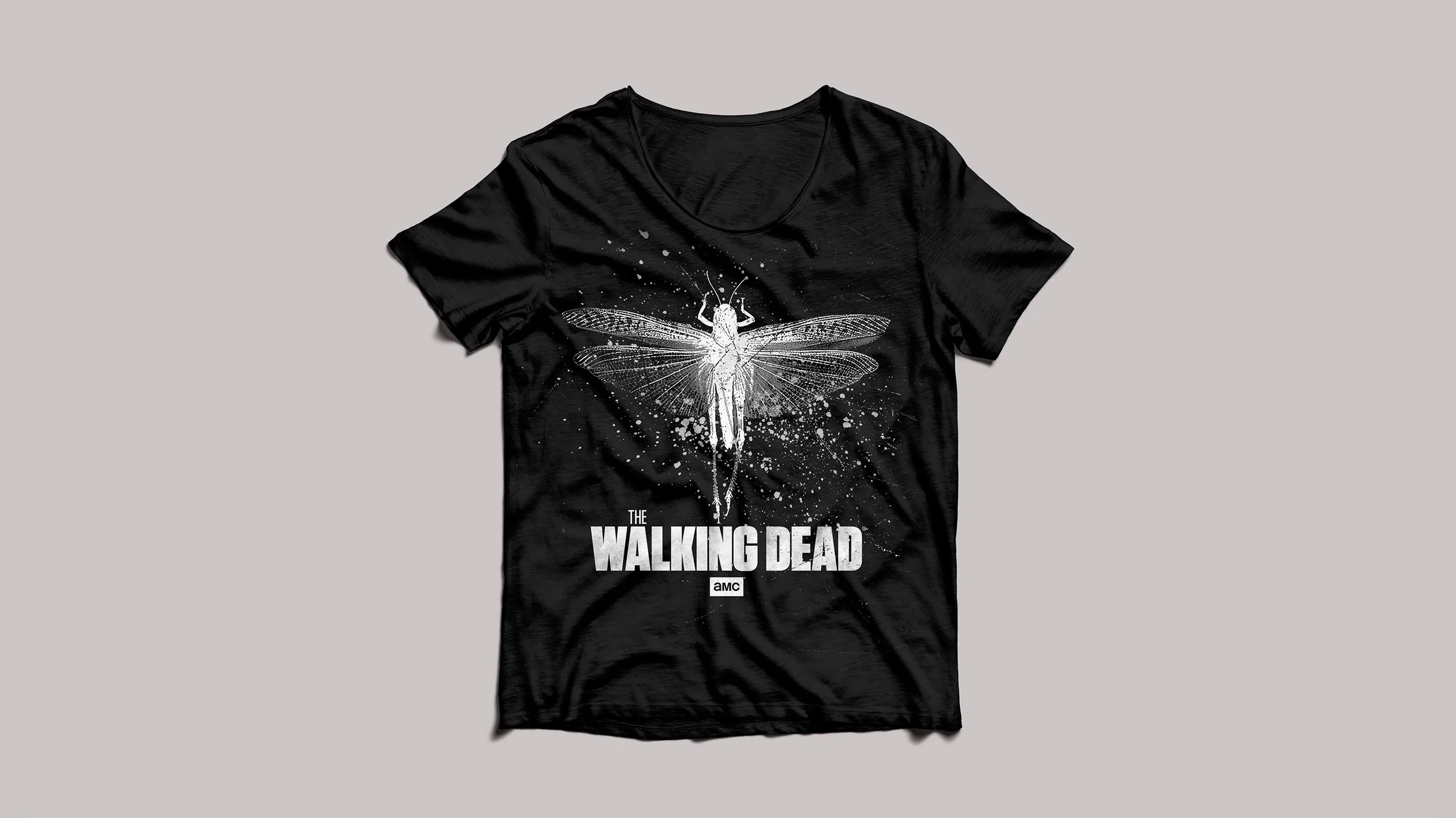 Black T-shirt featuring a white illustrated insect graphic with The Walking Dead logo.