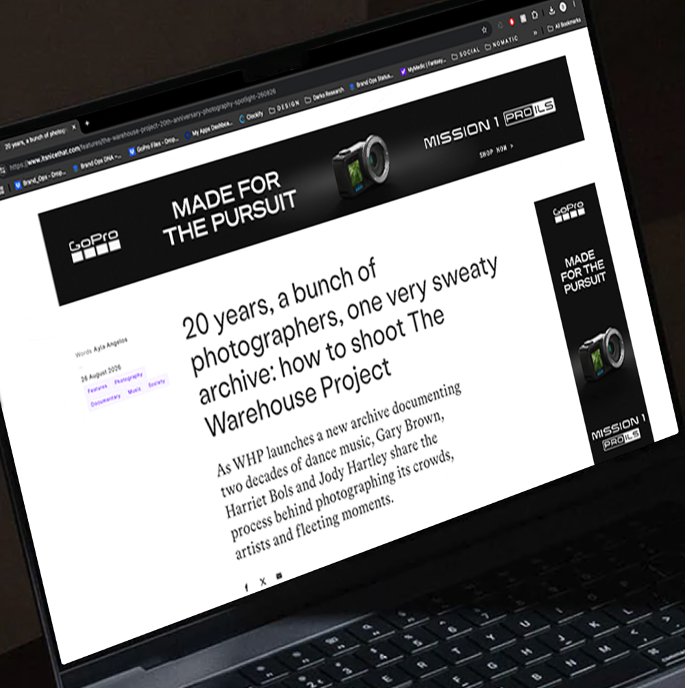 Laptop screen displaying a webpage about Gorpo's 20-year archive project, with a black header featuring Gorpo's logo, a camera icon, and the slogan 'Made for the Pursuit', alongside handwritten style and printed text.