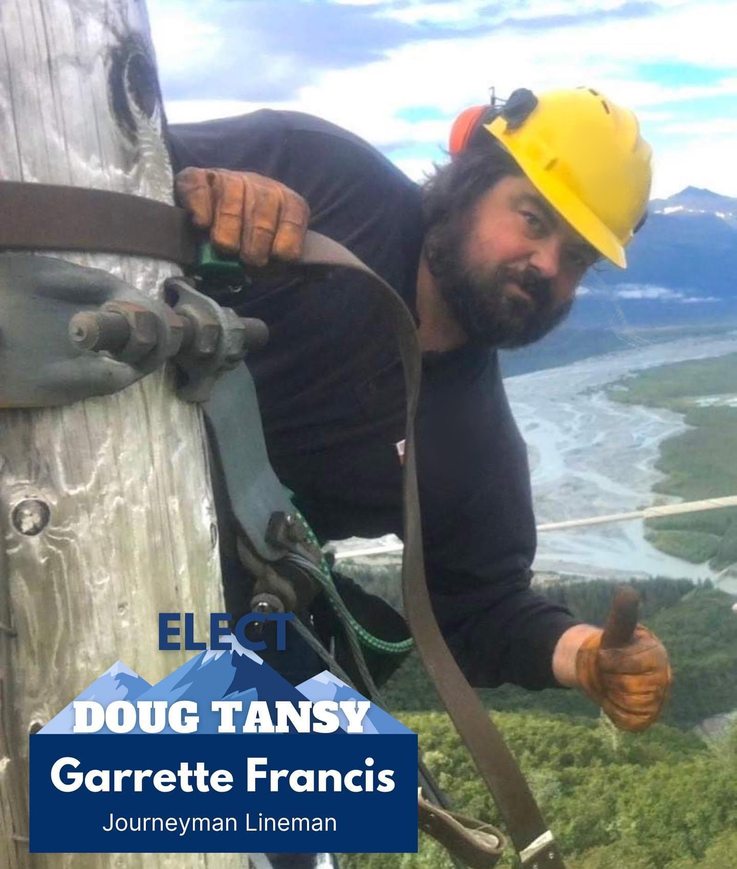 A man wearing a yellow safety helmet and gloves is working on a tall wooden pole, giving a thumbs-up, with a scenic river and mountainous landscape in the background. The image includes a political campaign overlay with the names Doug Tansy and Garrette Francis, identified as a journeyman lineman.