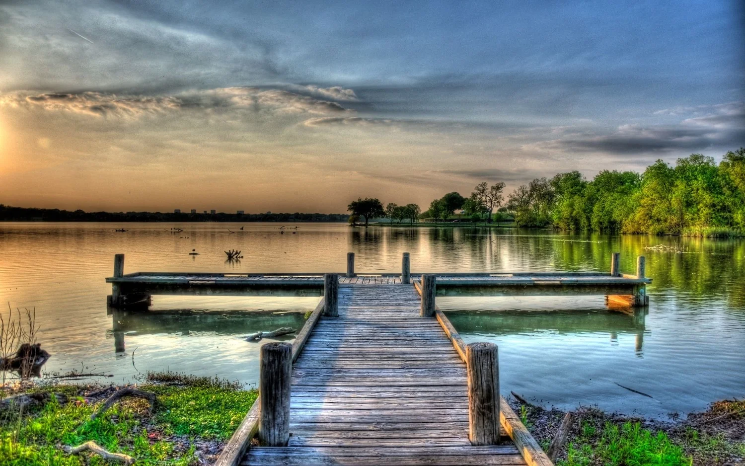 Wooden dock at White Rock Lake at sunset