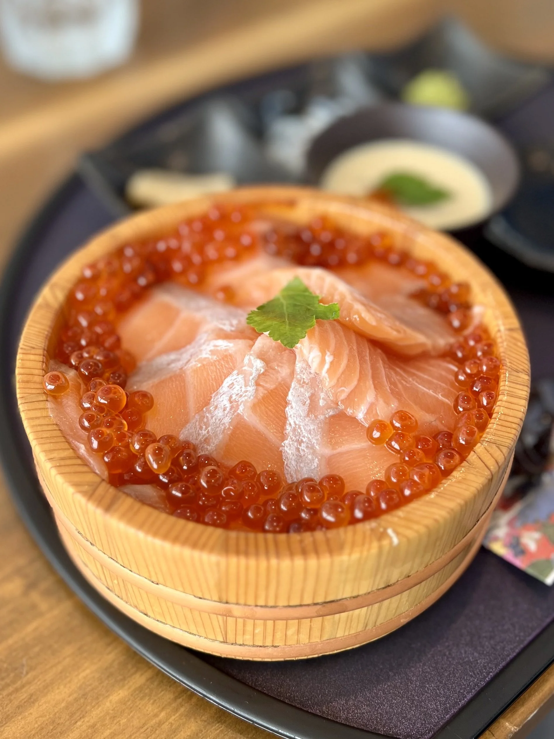 Salmon served with salmon roe.