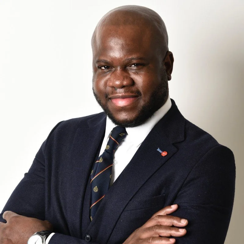 A black man wearing a suit