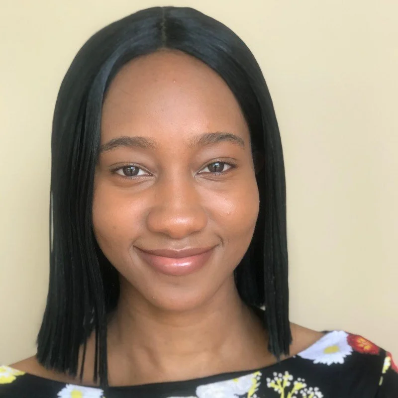 A black woman smiling