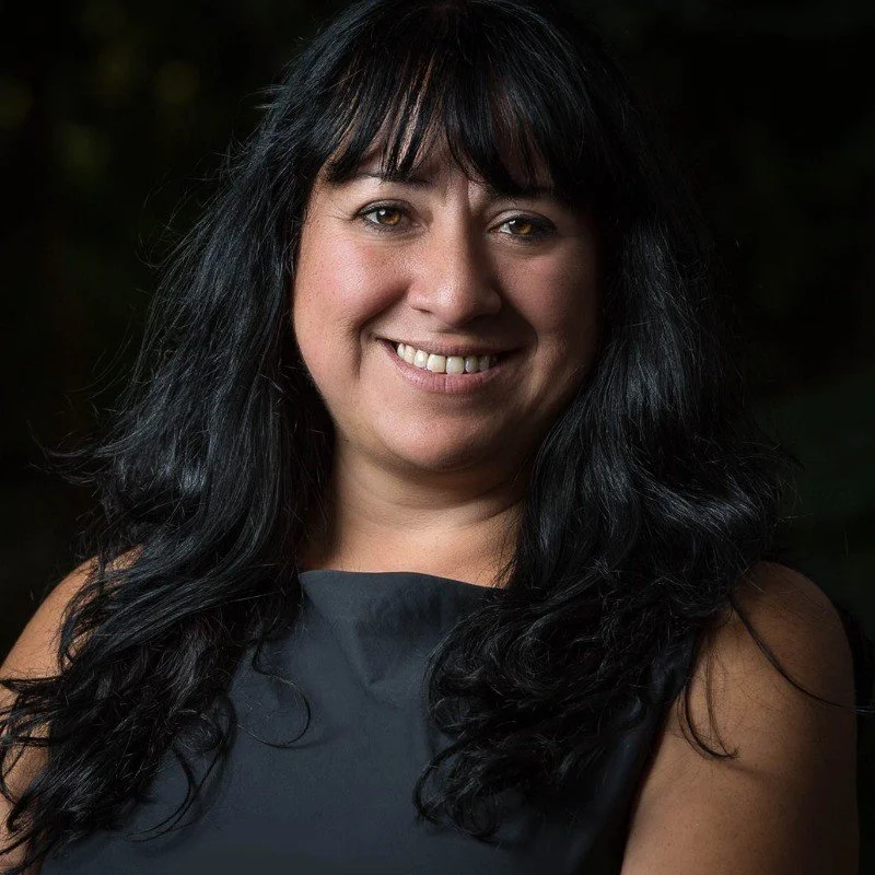 A caucasian woman smiling
