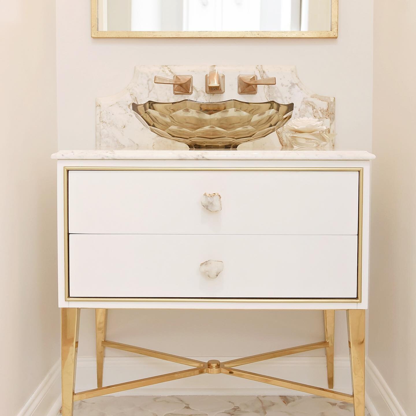 Powder Bathroom Renovation with all the details. From gold marble veining to agate rock knobs, this bathroom is a show-stopping beauty. 

#vanity #agaterockknobs #agaterock #marble #vesselbowl #goldlegs #wallmountfaucet #customizedvanity #interiordes