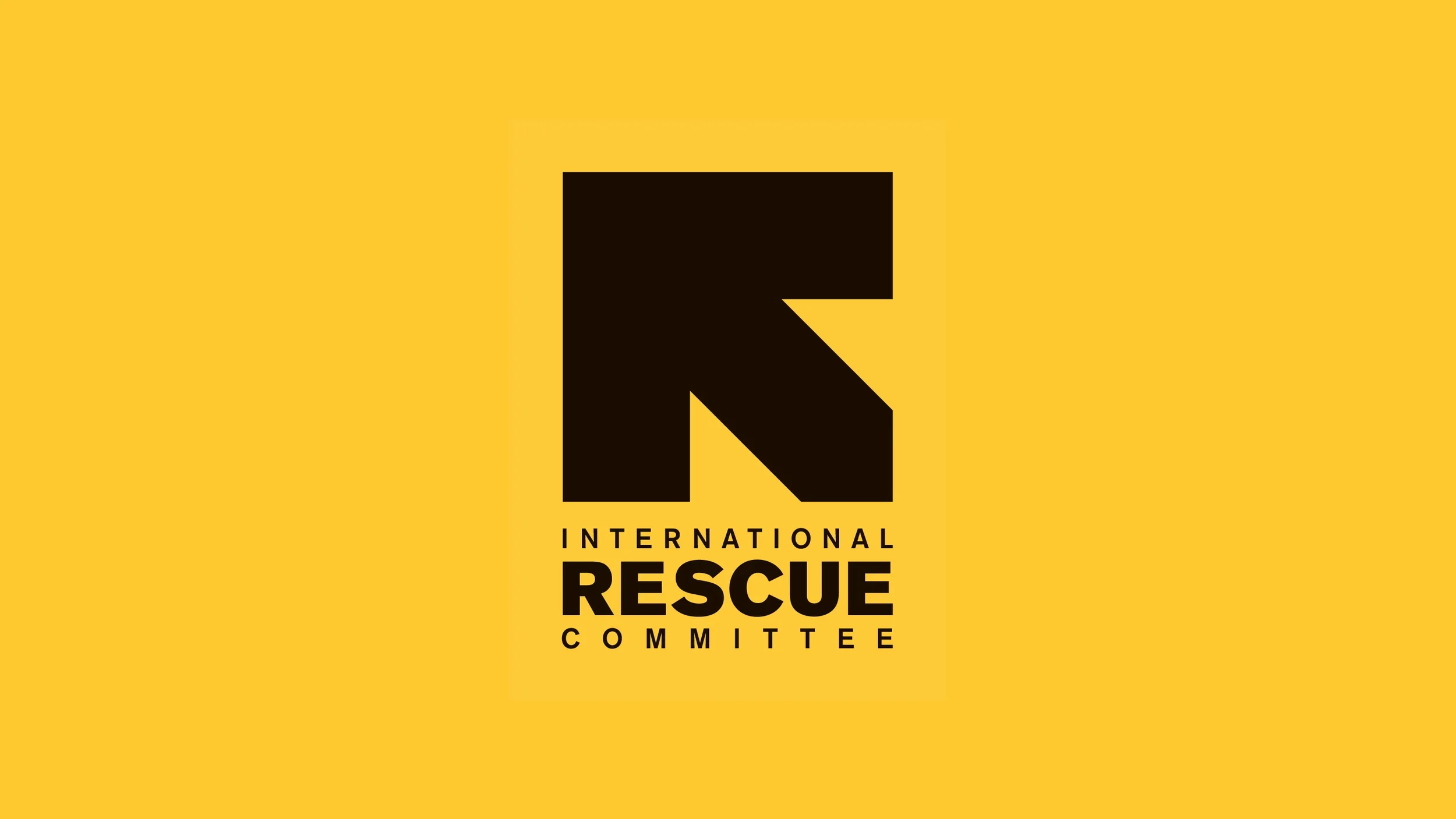 Logo of the International Rescue Committee featuring a black stylized letter R on a yellow background with the organization's name below