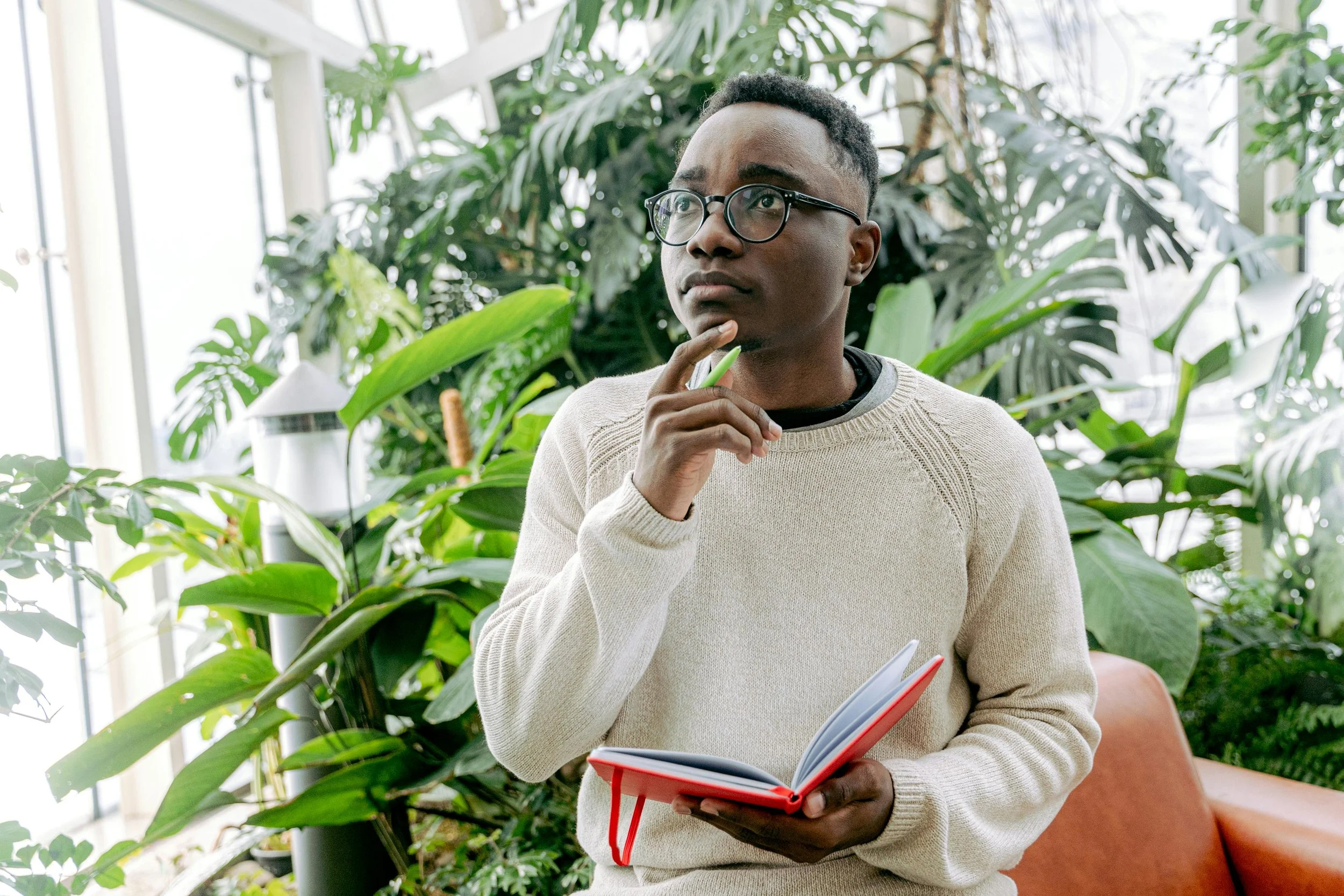 an ambitious young man going over multiple options he has in trying to make a difficult decision about his life or career