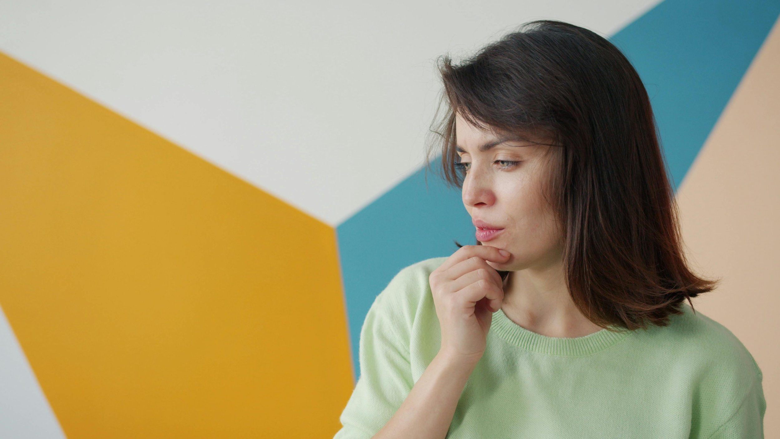 a smart professional woman trying to make a difficult decision in her life