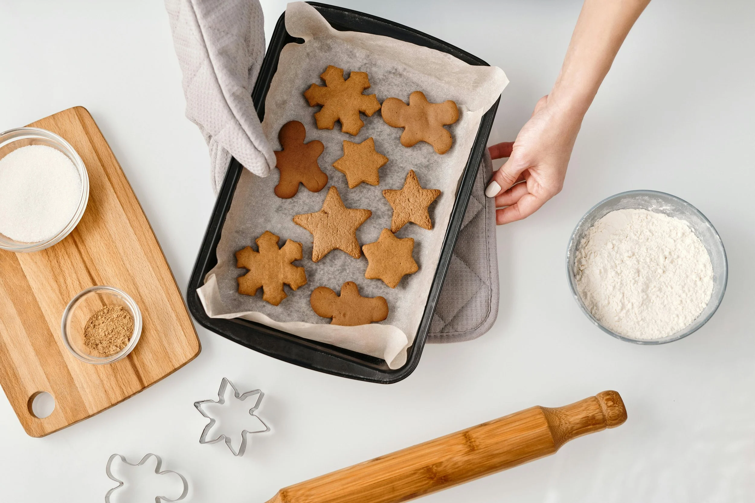 a positive but depressed woman baking cookies at home in her kitchen