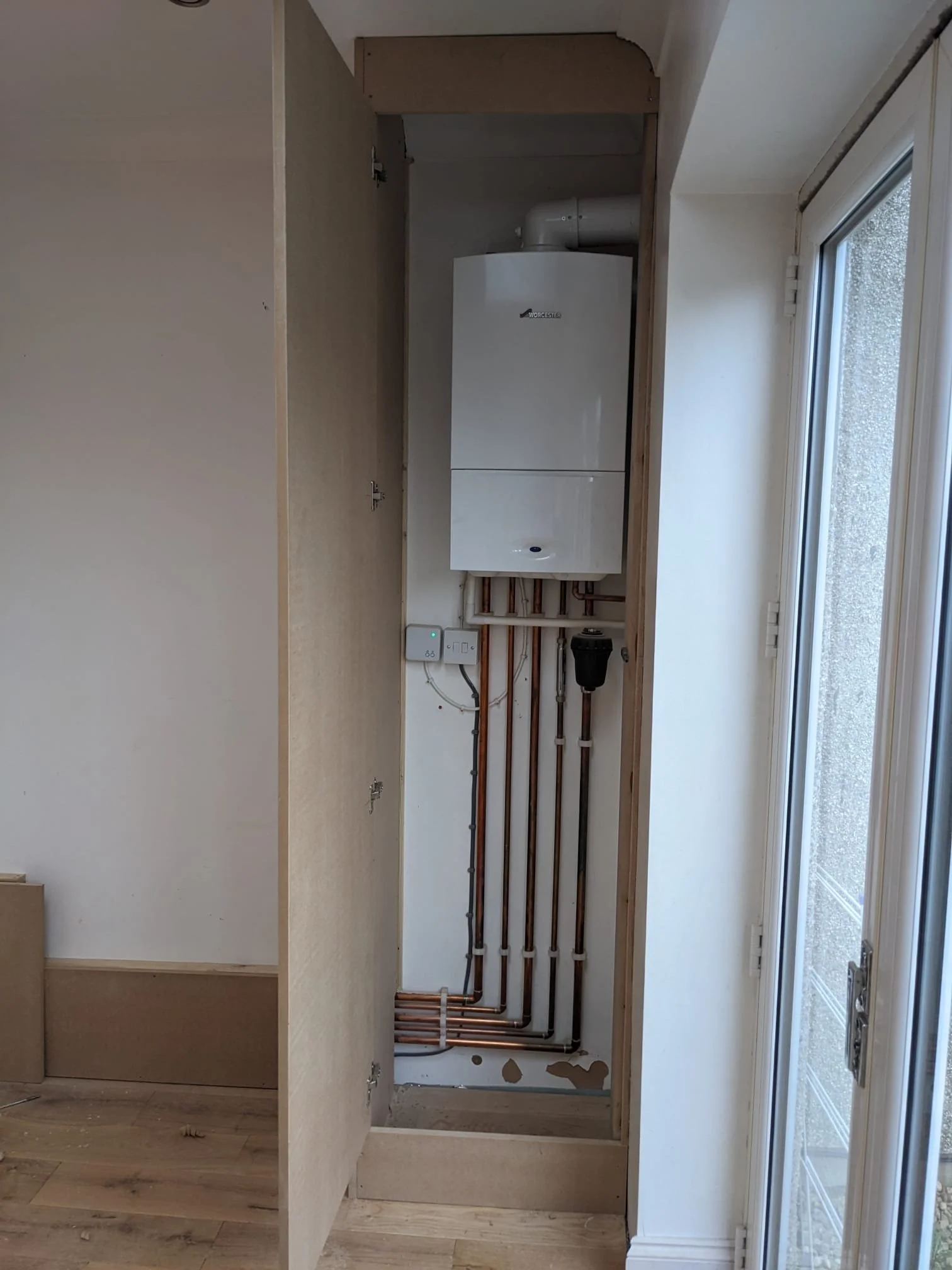 boxing in of a boiler in a cabinet