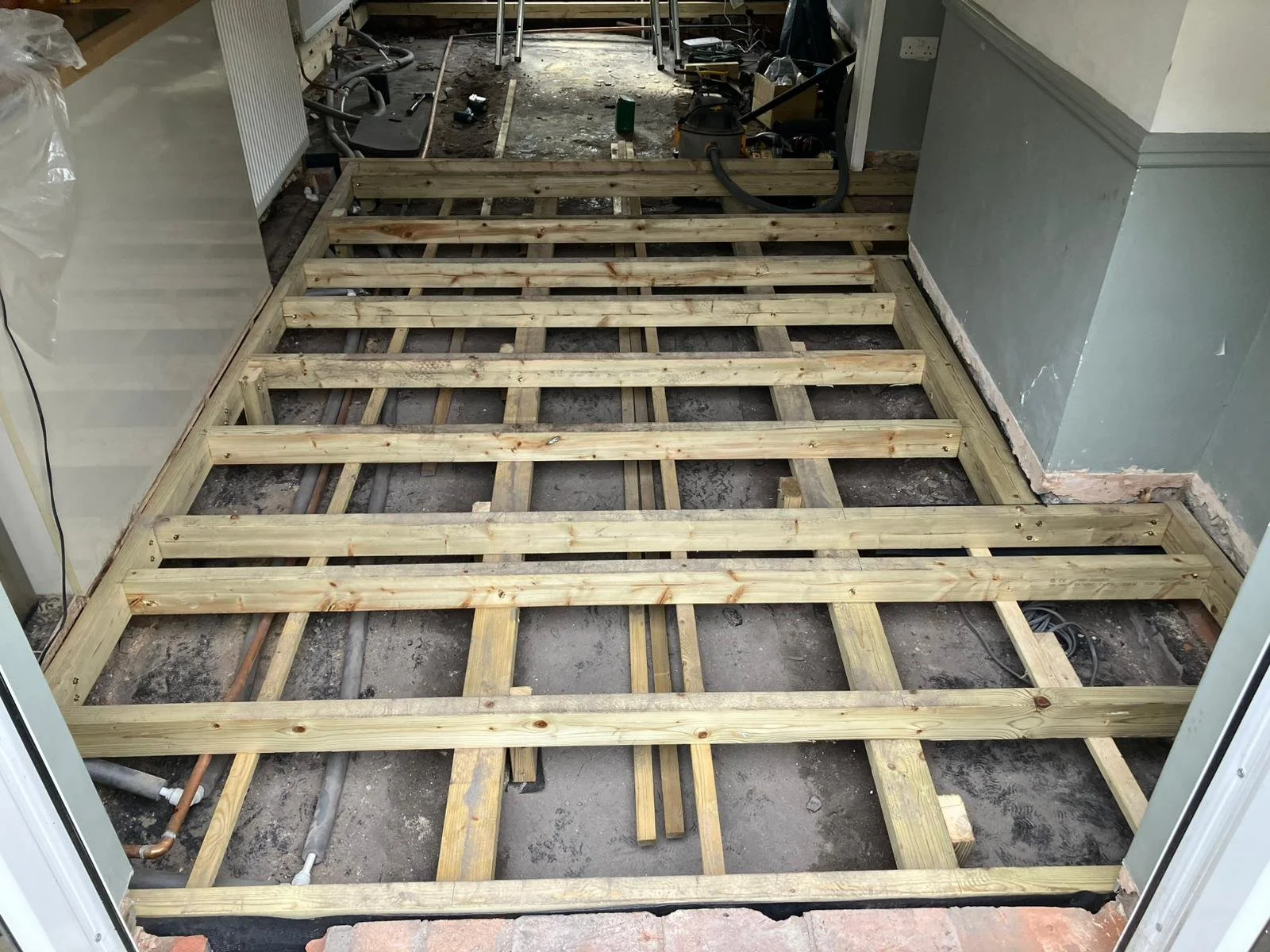 New timber suspended floor in progress of installation ready for insulation or flooring, Bristol