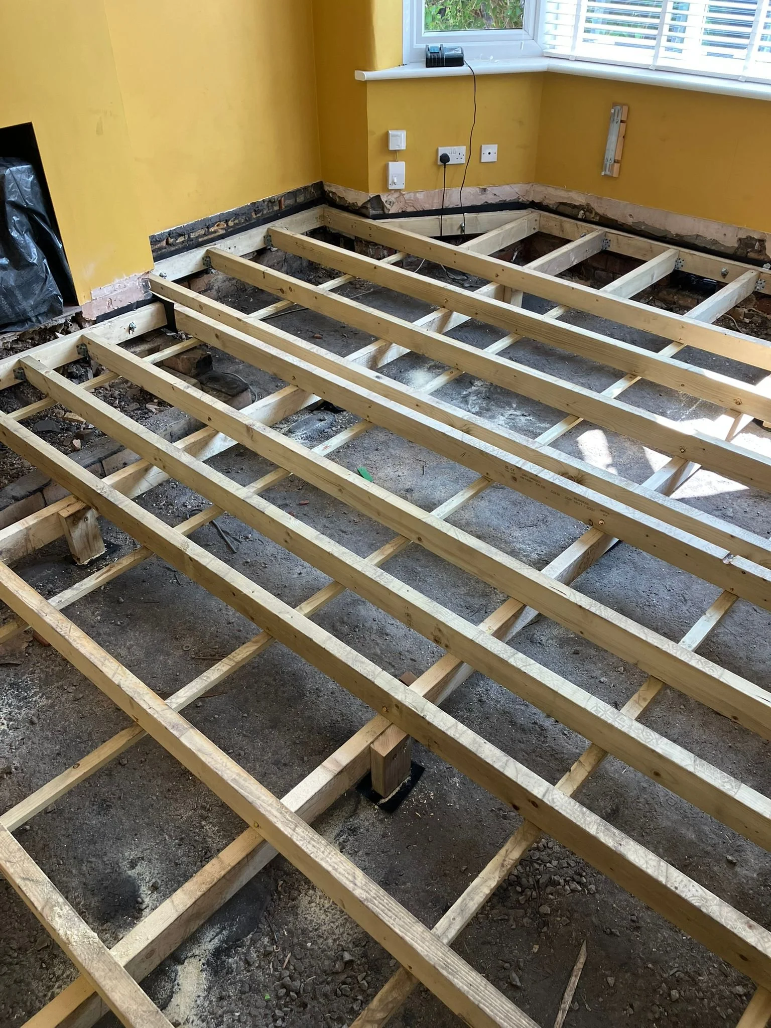 New timber suspended floor in progress of installation ready for insulation or flooring, Bristol