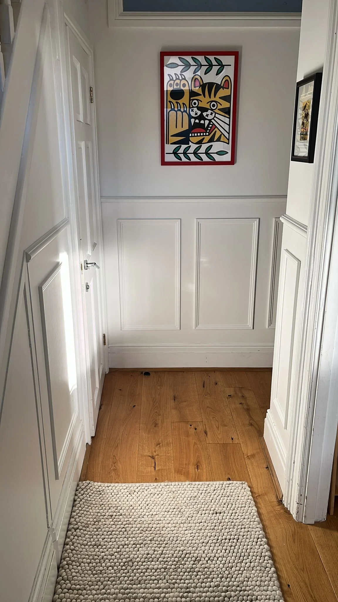 Wall panelling installed in a hallway in Bristol, completed and painted