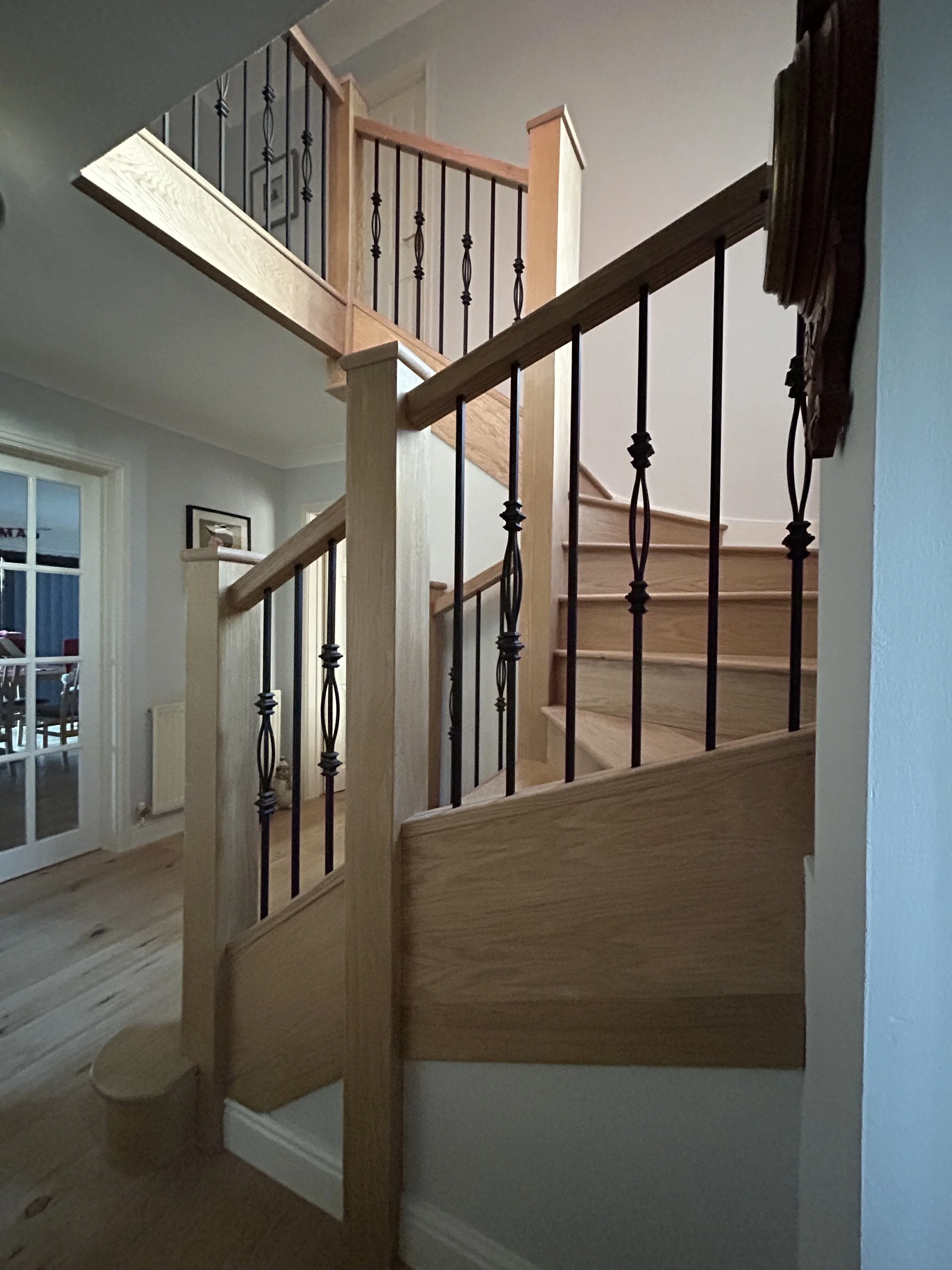 staircase clad, new bannister, newel posts, with black metal spindles in North Bristol in Winterbourne