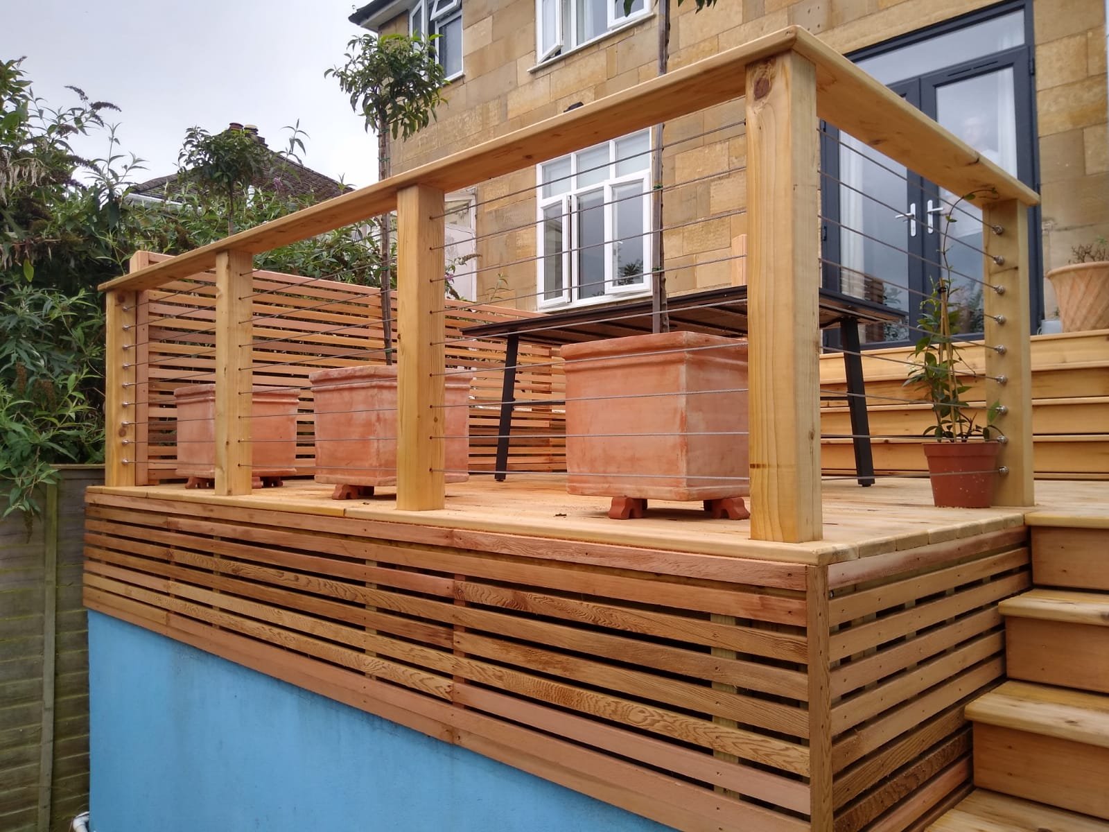 cedar decking an cedar and stainless steel rope balustrade