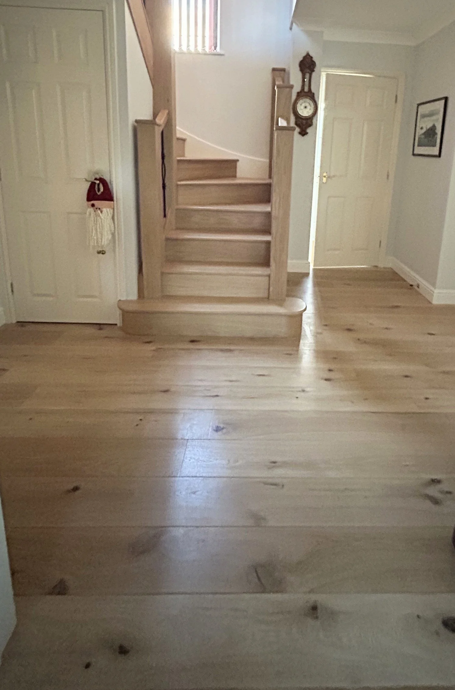 Ground floor renovation. New engineered oak floor laid, staircase clad, new bannister, newel posts, with black metal spindles in North Bristol in Winterbourne