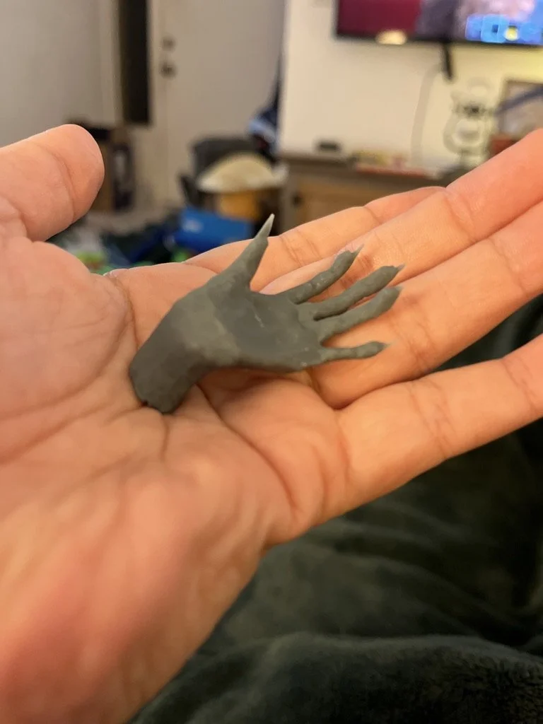 first print of my first attempt to 3D model a hand from scratch using Blender