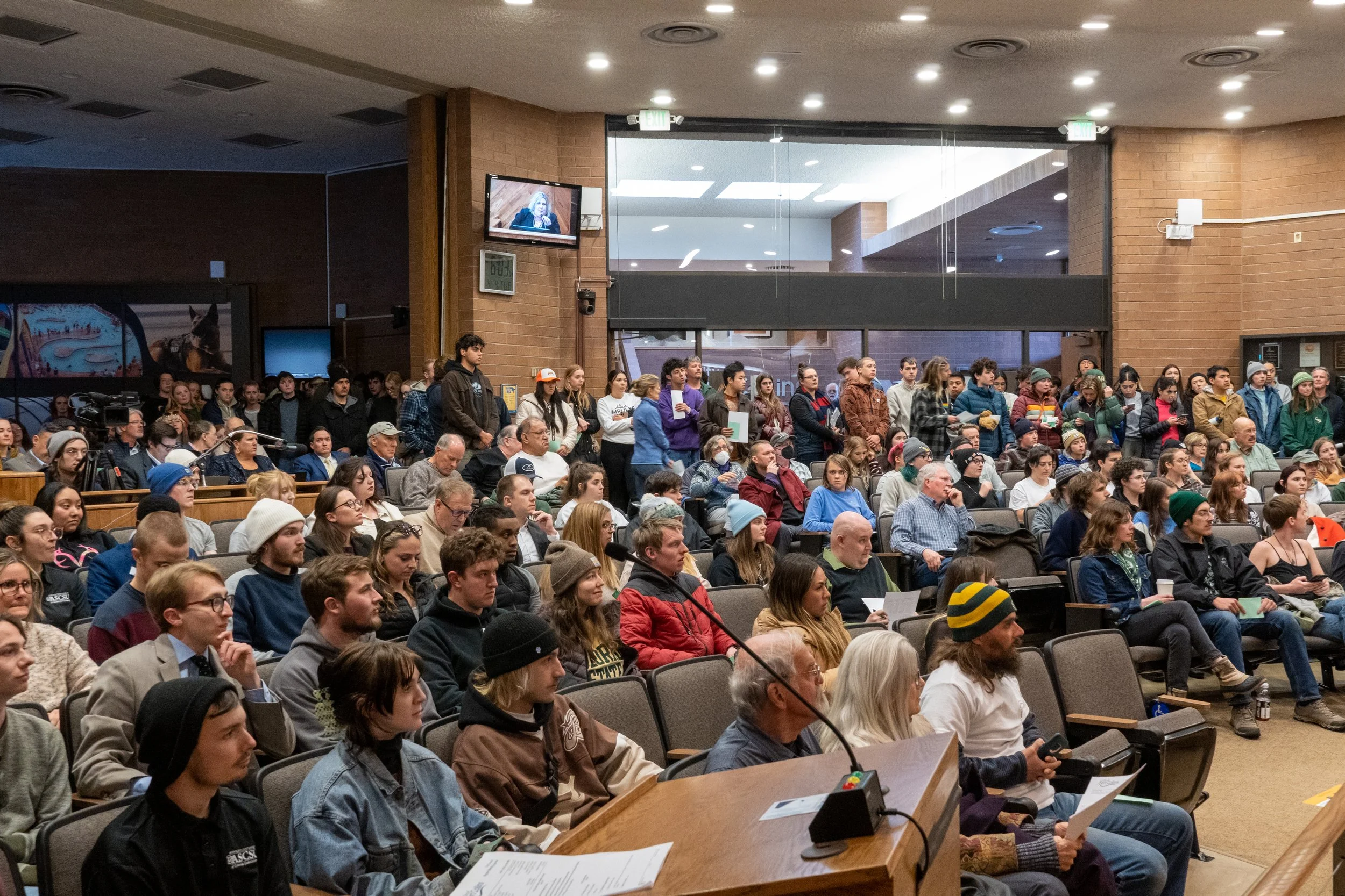 Students pack City Council chambers, demonstrate against U+2
