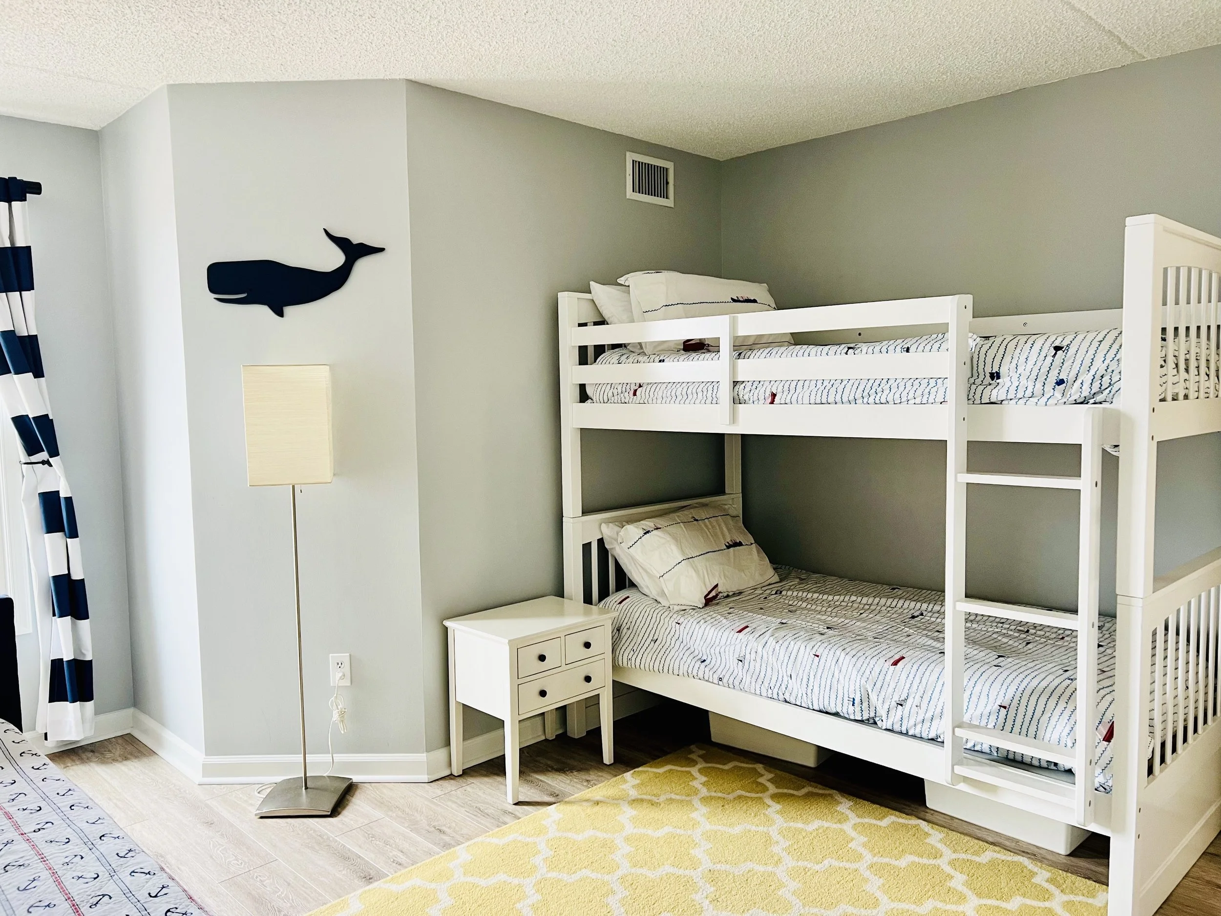 Second bedroom sleeps 4 with bunkbeds, opposite side is a day bedroom with a trundle