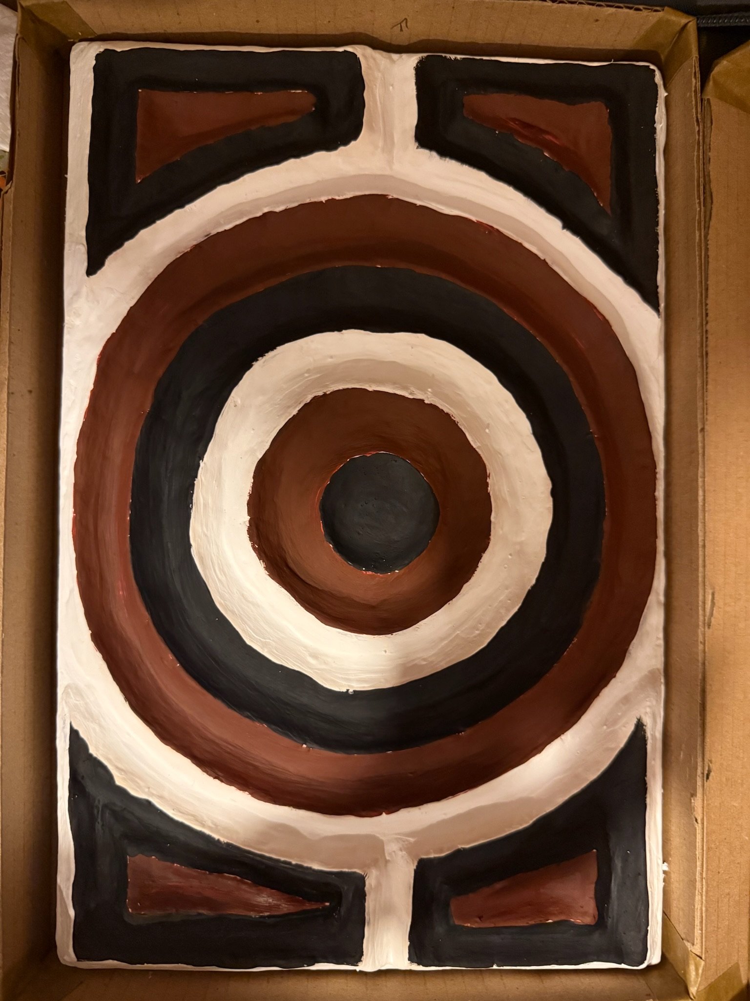 Traditional Imigongo painting using cow dung
