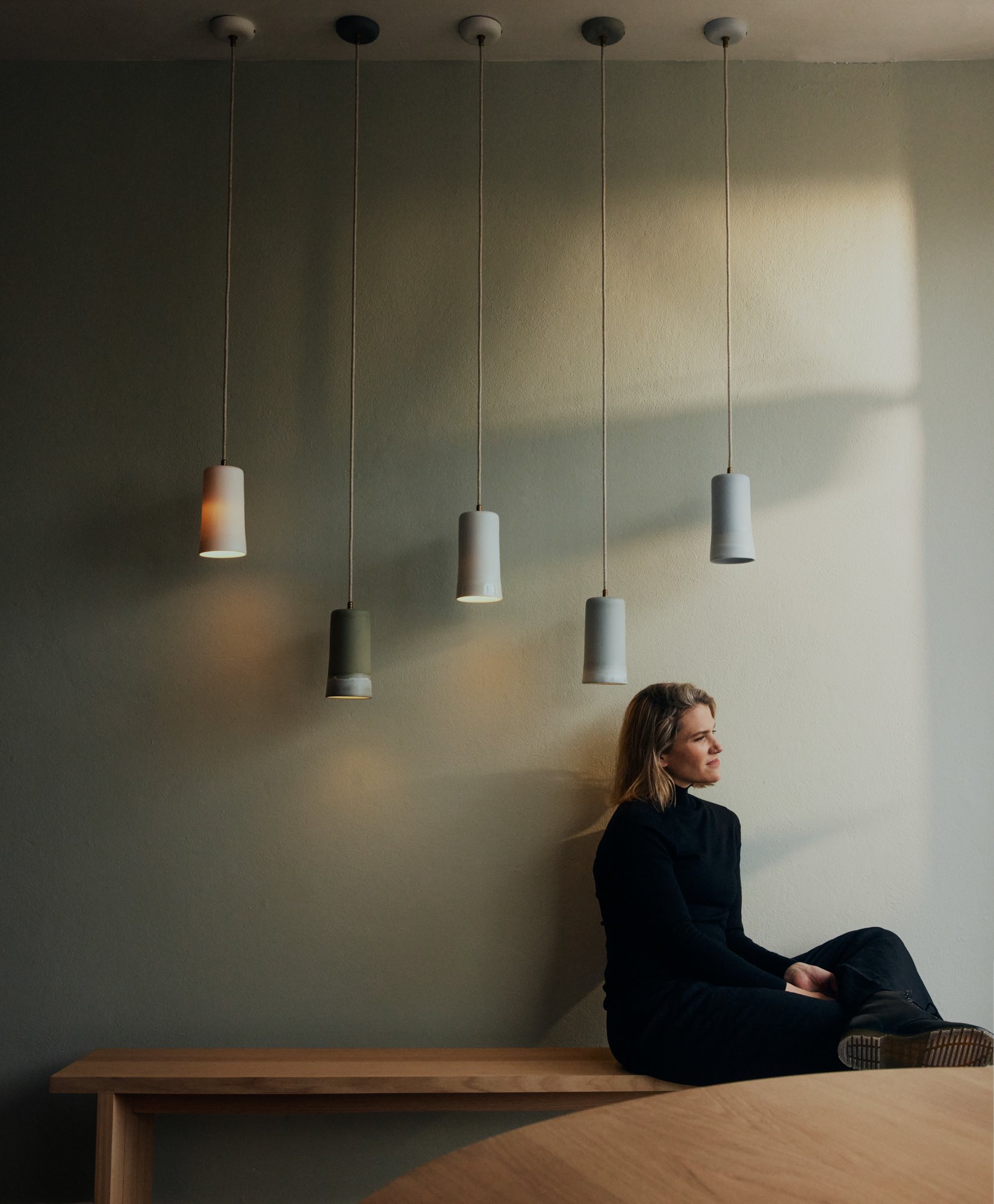 Designer Naomi Taplin with Studio Enti pendant lighting