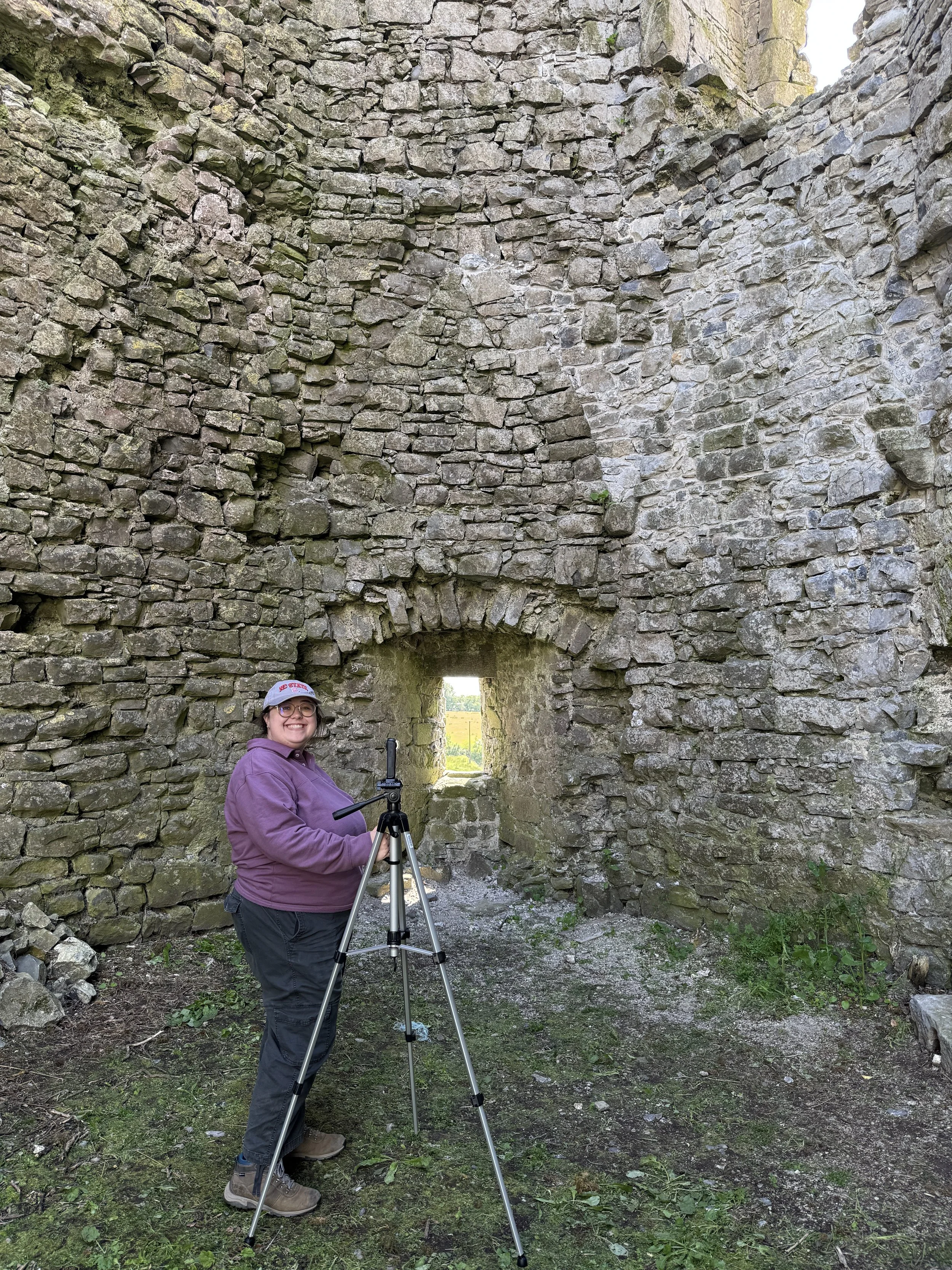 Wendy taking 360 video and photographs of one of Ballintubber Castle's towers, Summer 2025. 