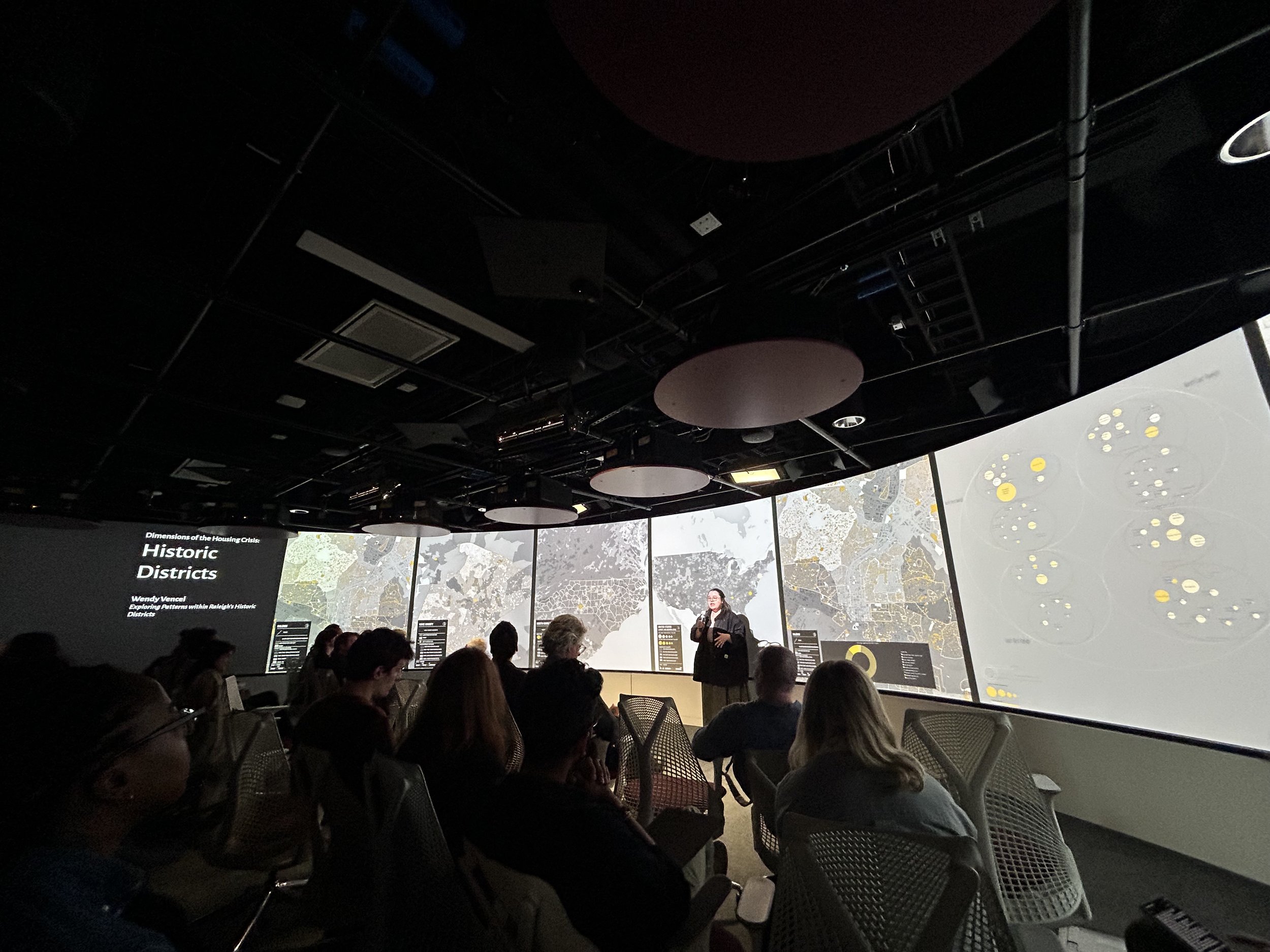 Wendy presenting a mapping project on historic districts in Raleigh, NC in 2024. 