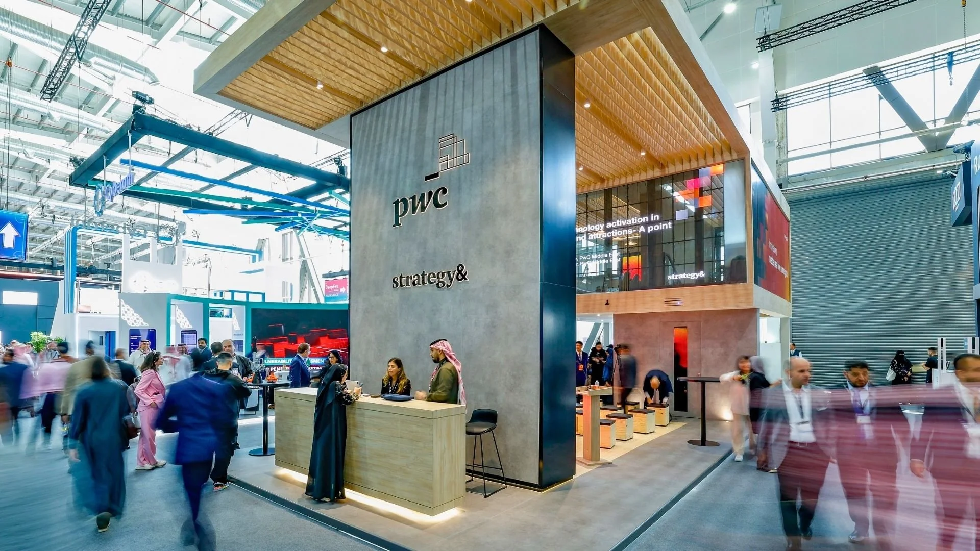 Business professionals at an exhibition in the Gulf, representing corporate Arabic use in the Arab business environment