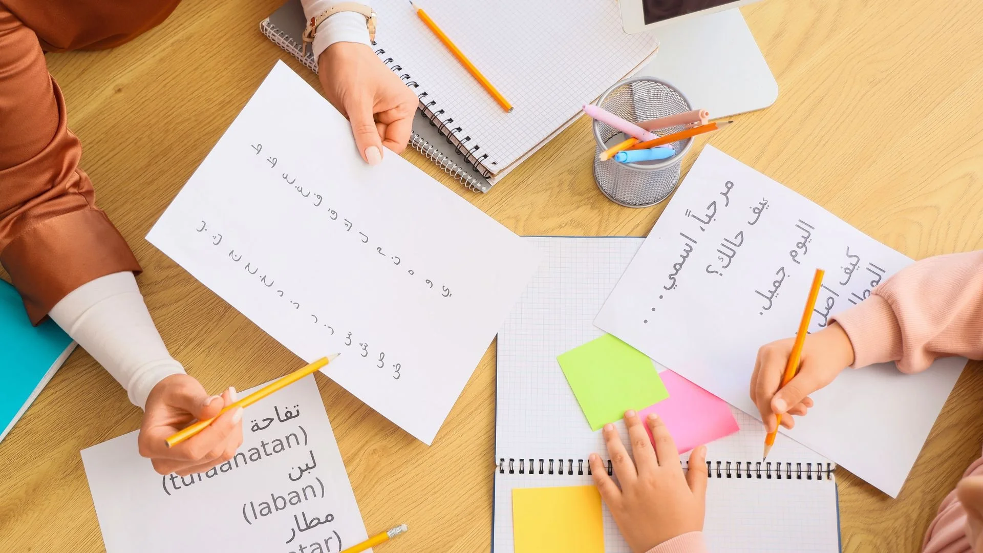 Professionals practicing Arabic business phrases for communication during Ramadan