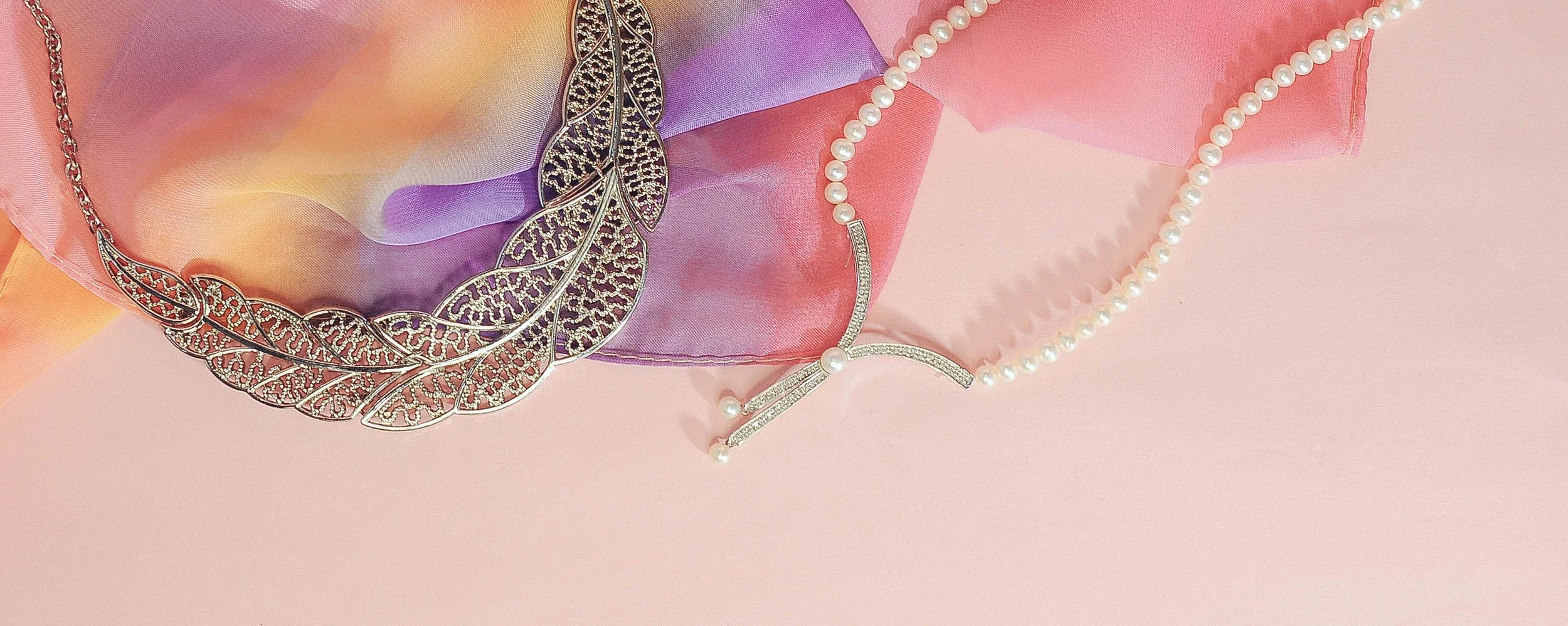 Pearls and pink scarf