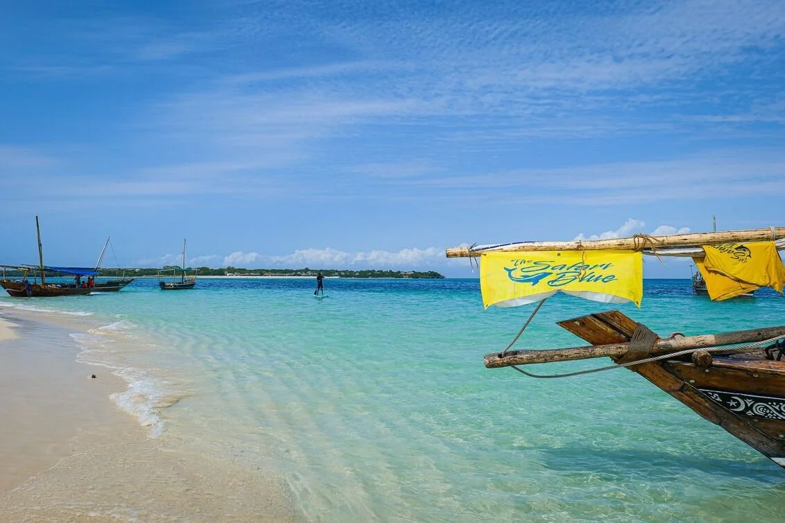 safari_blue_boat_docked_by_zanzibari_beach.jpg