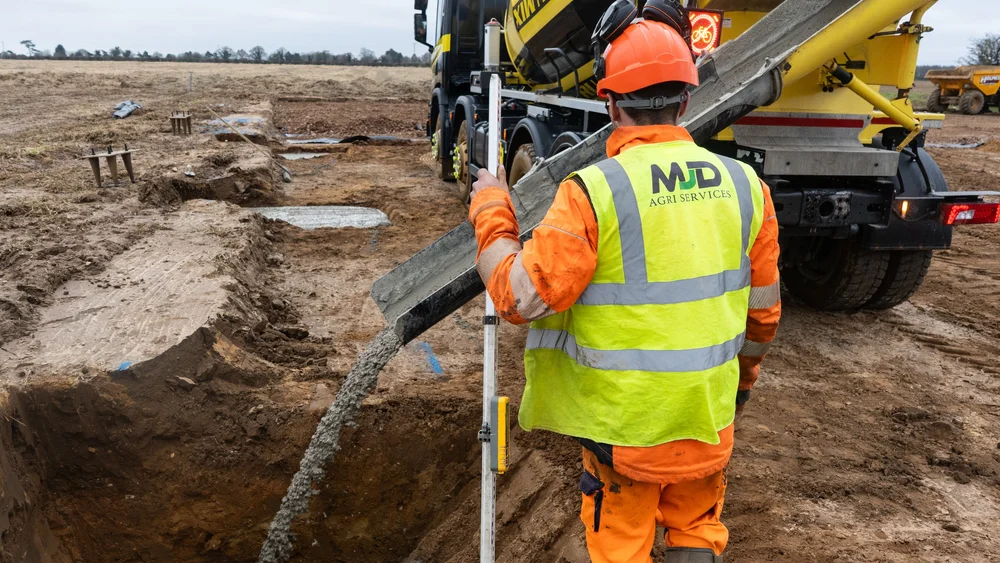 Concrete being poured for new foundations