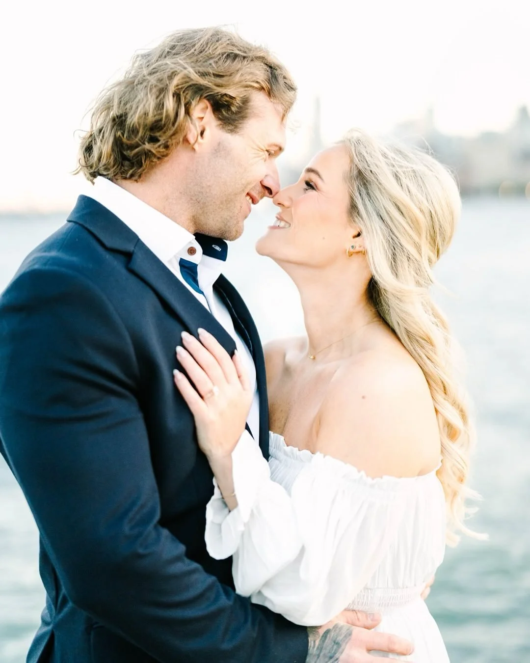 Madison &amp; John Part II 

The perfect way to cap off a Chicago engagement session on Lake Michigan 🌊 I could never tire of this skyline, the beautiful blue tones of the lake, and the crazy wind that compels everyone to be free, let go, and just h