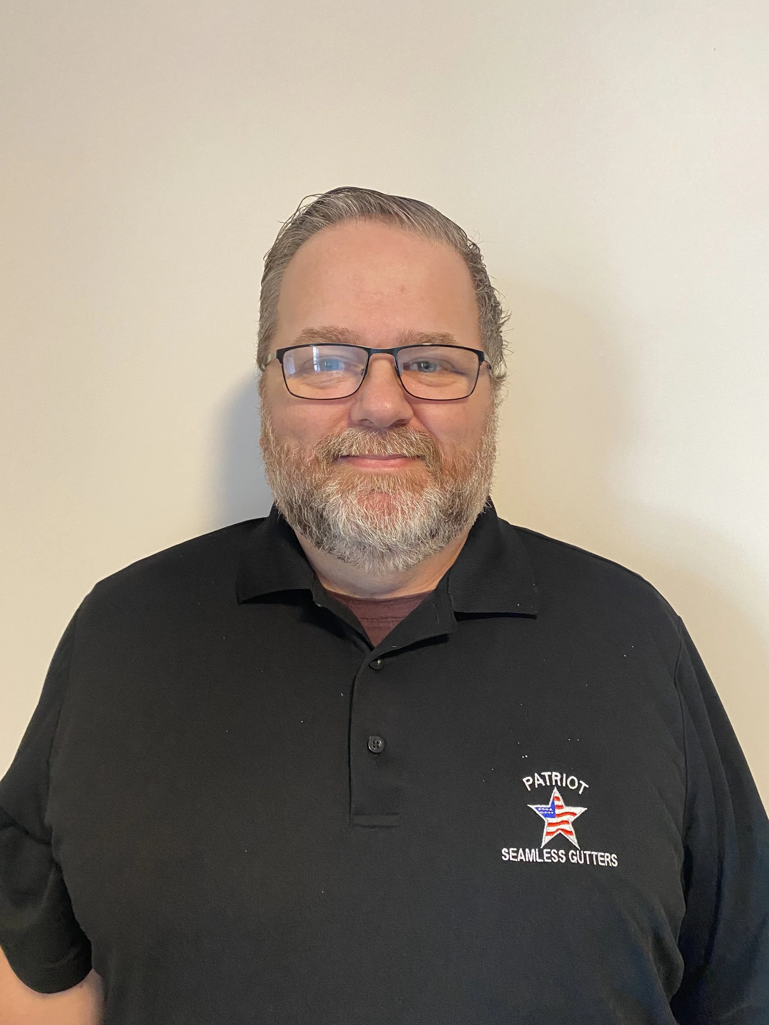 Logo for Patriot Seamless Gutters with red, white, and blue patriotic colors and a star, followed by the text "Photo Not Available" in black.