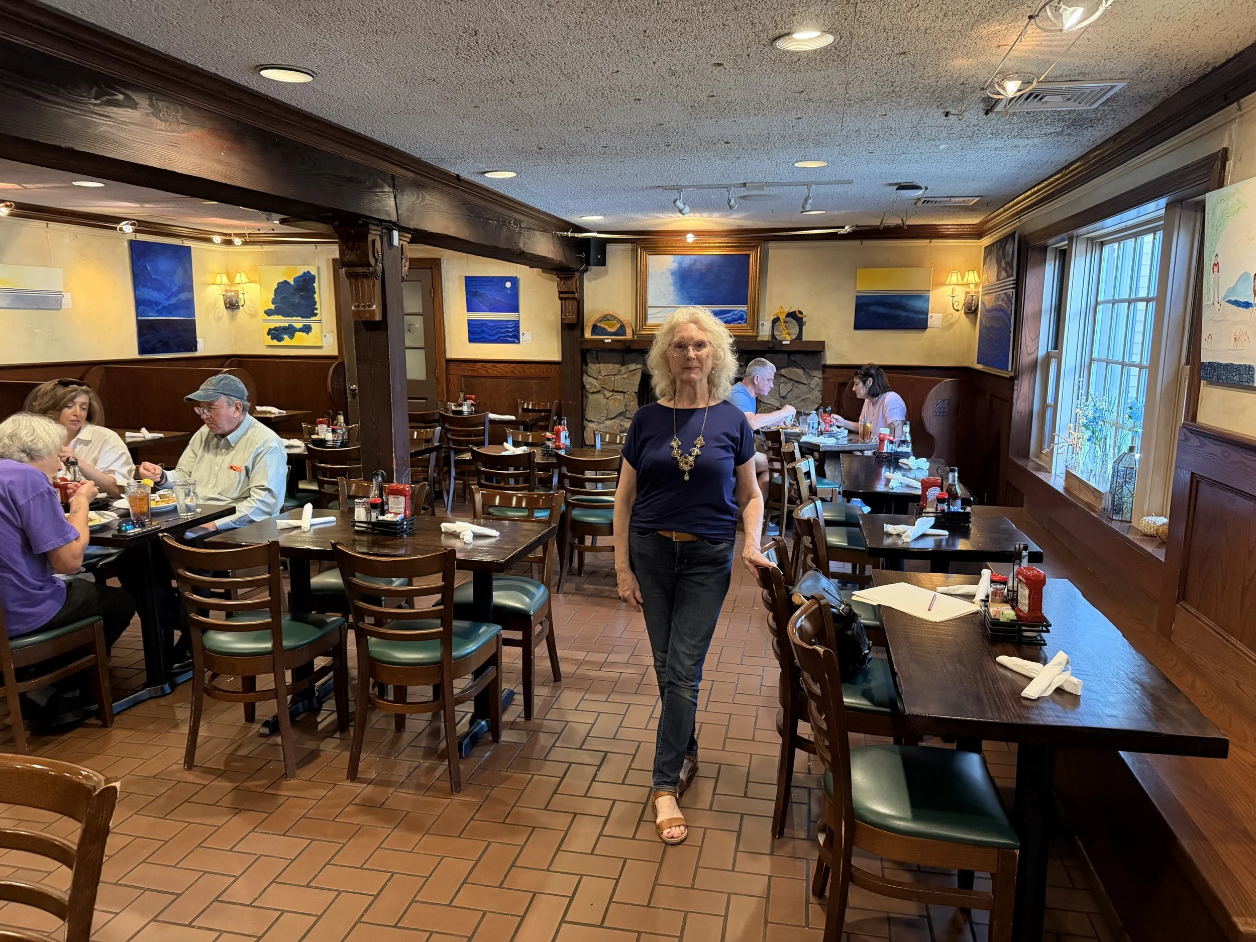 Monique with her paintings at the Brogue