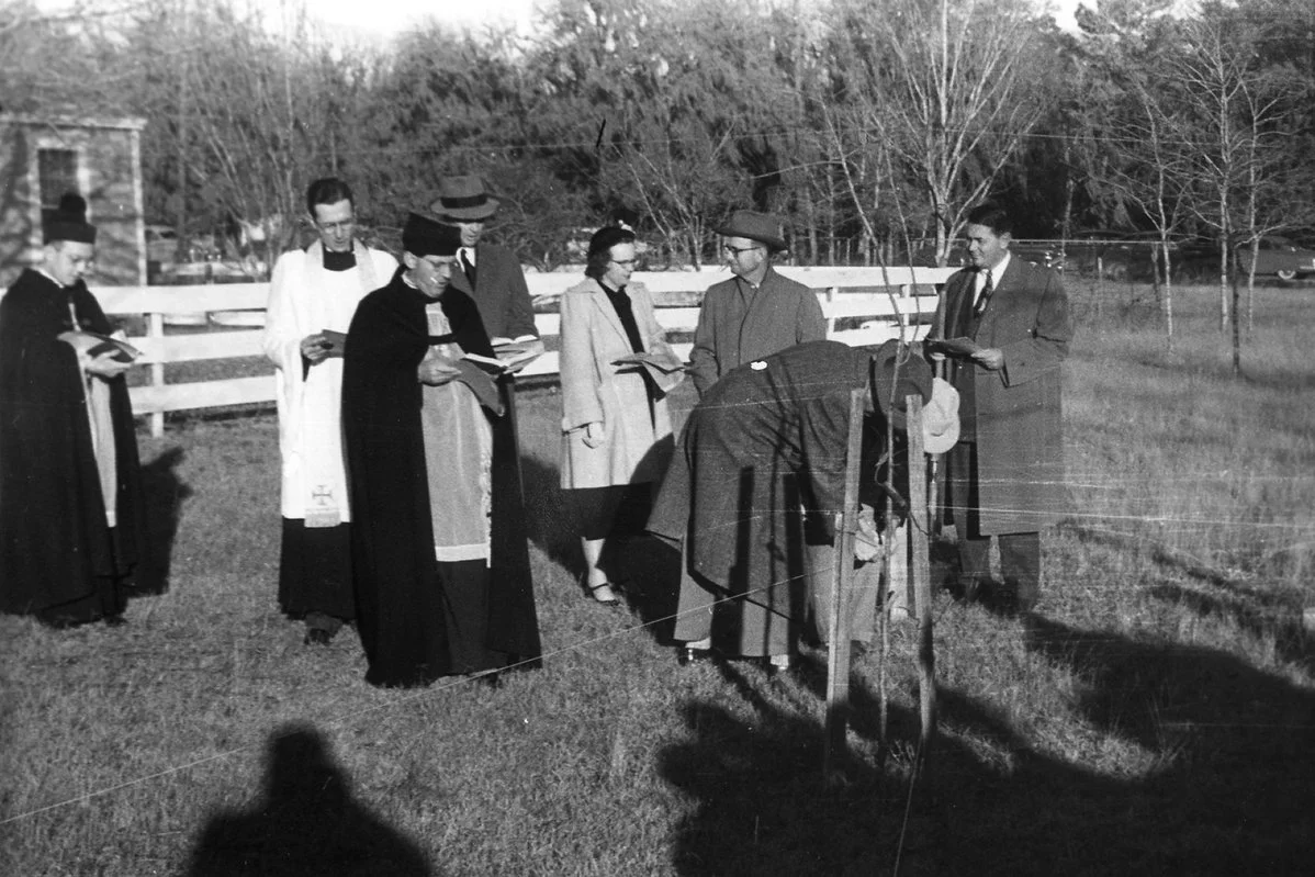 1951 man bending at stakes.jpg