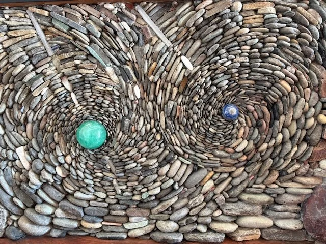 Worldly fireplace (detail), January 2026, River rock, crystal, maple wood, 15'x10'