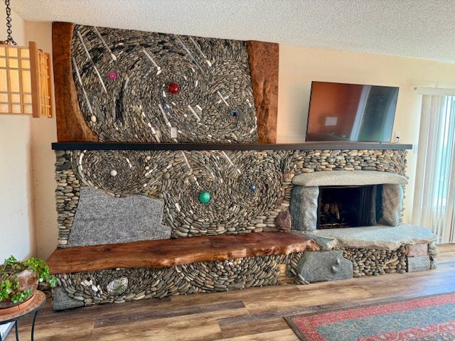 Worldly fireplace, January 2026, River rock, crystal, maple wood, 15'x10'