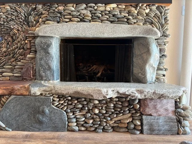 Worldly fireplace (detail), January 2026, River rock, crystal, maple wood, 15'x10'