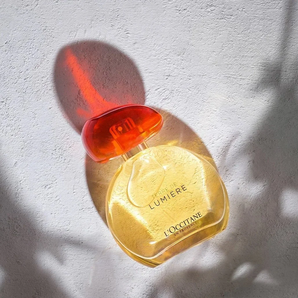 perfume bottle with sun shadows