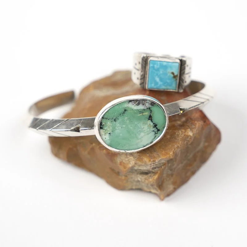 two silver and turquoise rings