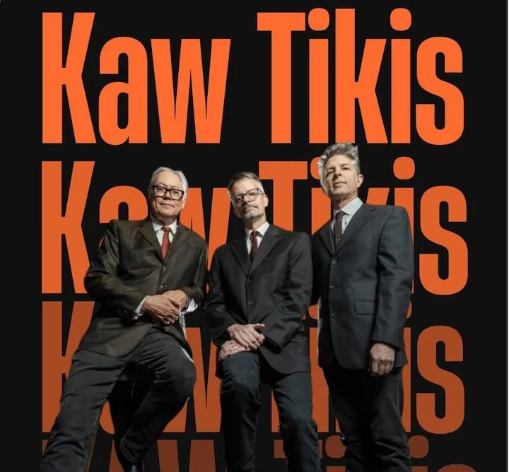 three men in suites with "Kaw Tiki" graphic text