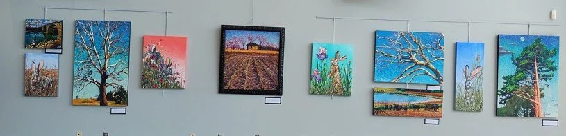 oil paintings on gallery wall
