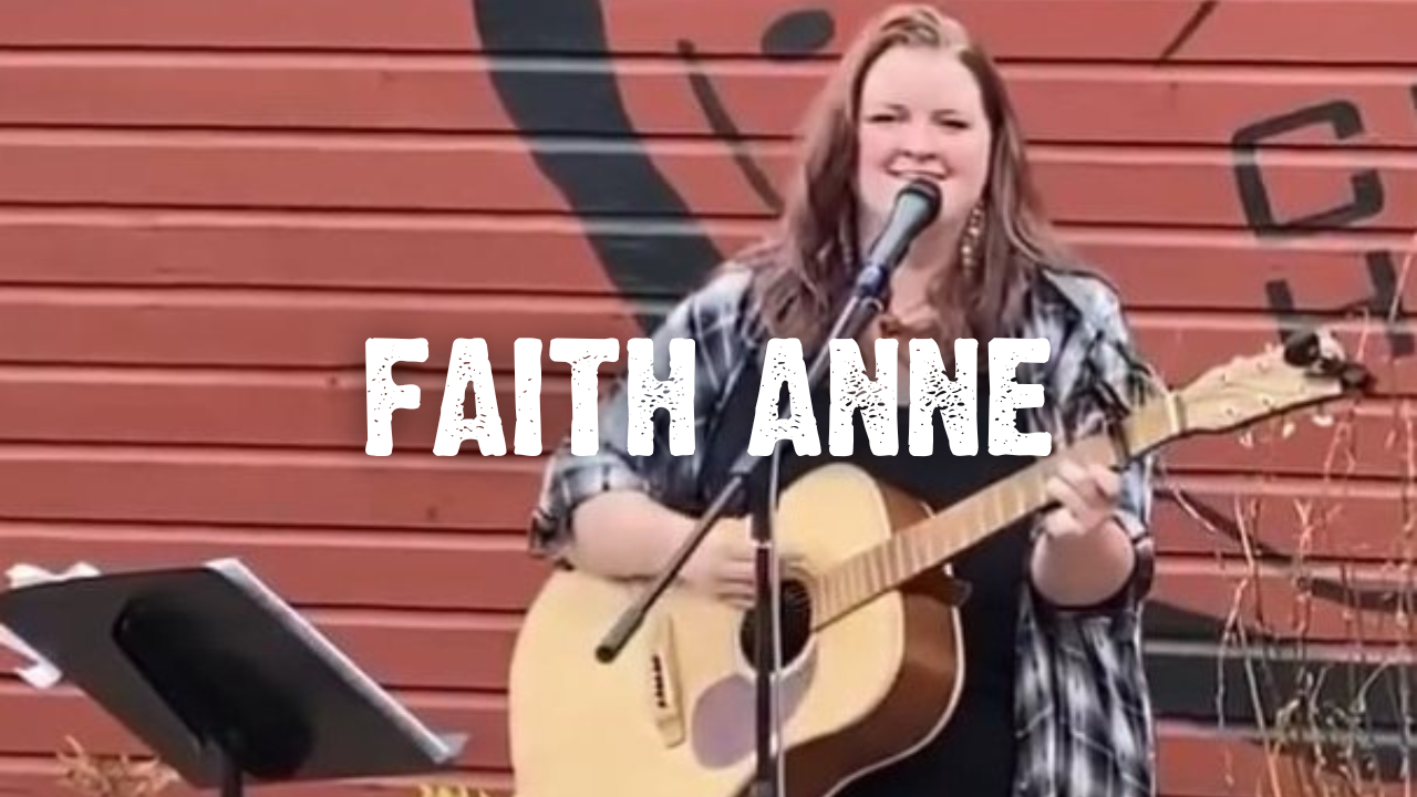 Faith Anne, Woman playing guitar and singing in front of a microphone