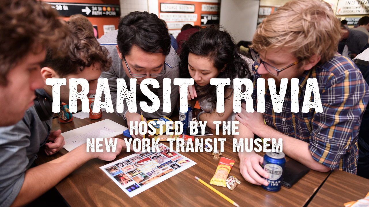 Transit Trivia hosted by the New York Transit Museum with 5 people looking at a trivia picture round on a desk with transit signs behind them and drinking beer